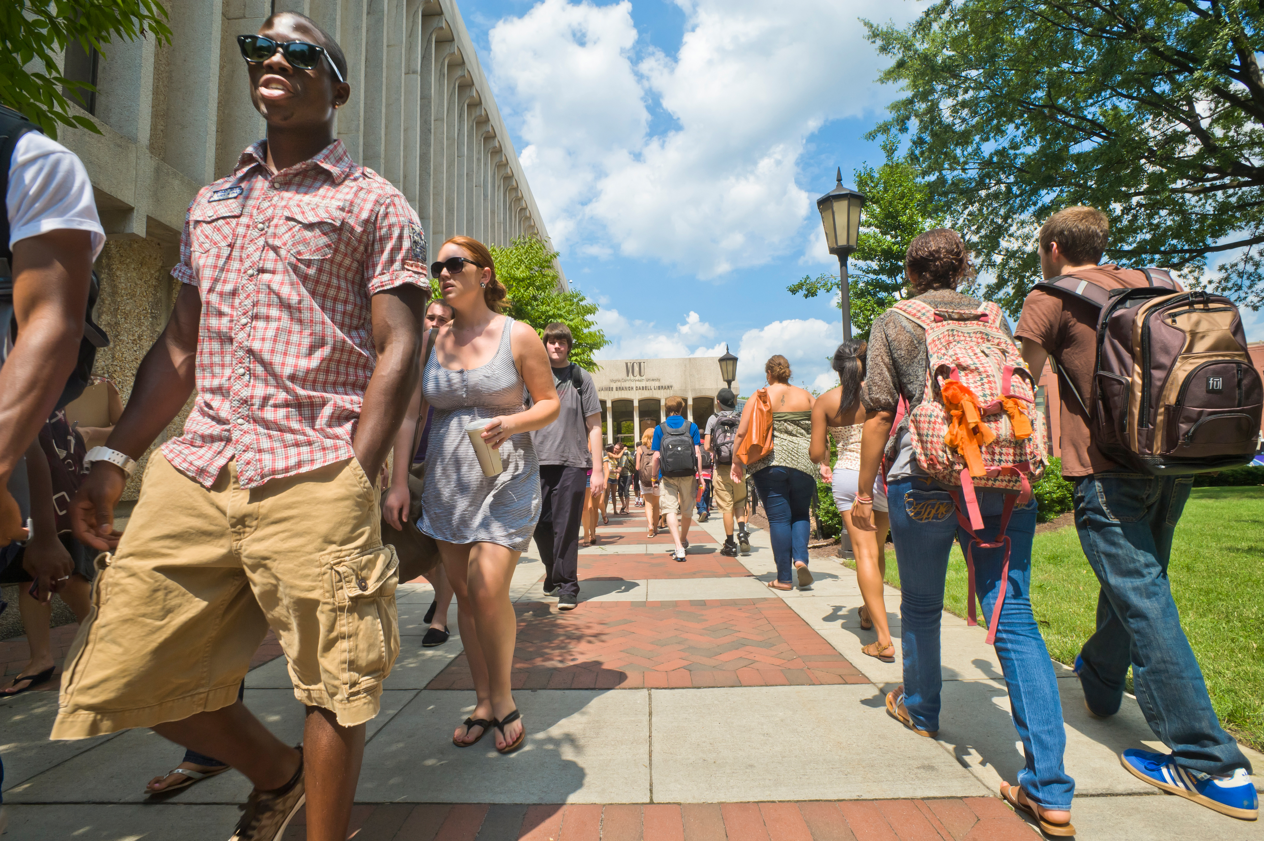 Students walk to and from class outside Cabell Library on the Monroe Park campus