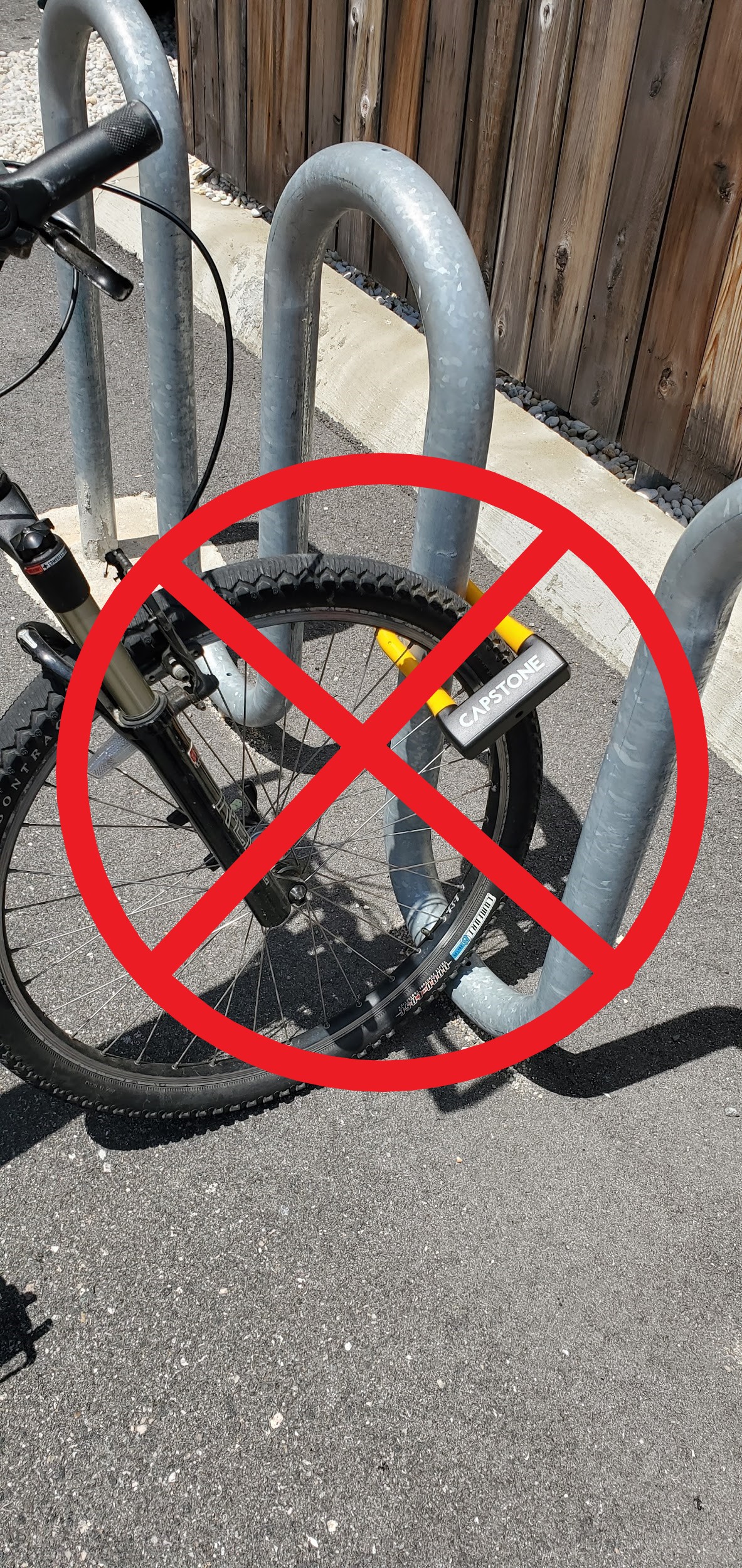 A bike lock that is only securing the front tire of the bike and not the bike frame.